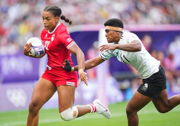 July 28, 2024, Paris, FRANCE: Canada back Keyara Wardley (12) scores a try past Fiji back Maria Rokotuisiga (11) during second half Women rugby 7s rugby action at the Paris Summer Olympics in Paris, France on Sunday, July 28, 2024. Canada News - July 28, 2024  - ZUMAc35_ 20240728_zaf_c35_052 Copyright: xNathanxDenettex