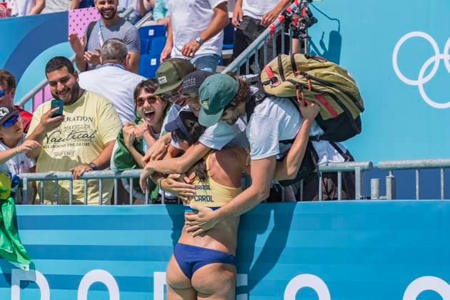 July 28, 2024, Paris, Ile de France, France: CAROLINA SOLBERG SALGADO (BRA) (1) and BARBARA SEIXAS DE FREITAS (BRA) (2) celebrate with friends and family after defeating Team Japan (JPN) in the Preliminary Phase - Pool E Women s Beach volleyball, Beachvolleyball at the Stade Tour Eiffel stadium during the 2024 Paris Summer Olympics in Paris, France. Paris France - ZUMAa161 20240728_oly_a161_084 Copyright: xWalterxArcex