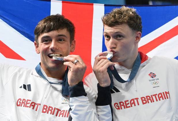 29th July 2024; Paris Olympic Games, Olympische Spiele, Olympia, OS Paris, France, Day 4; Aquatics Centre, Mens Synchronised 10m Platform diving final, Tom Daley and Noah Williams kiss their silver medals  ActionPlus12674106 SimonxWest