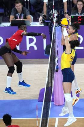 (240729) -- PARIS, July 29, 2024 -- Veronica Adhiambo Oluoch (L) of Kenya spikes the ball during the women s preliminary round pool B of volleyball between Brazil and Kenya at the Paris 2024 Olympic Games, Olympische Spiele, Olympia, OS in Paris, France, July 29, 2024. Li Gang) (PARIS2024) FRANCE-PARIS-OLY-VOLLEYBALL ligang 
