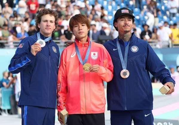 Japan s Yuto Horigome (C) and (L) Jagger Easton and (R) Nyjah Houston pose with their medals after the Men s Street Skateboard final at Place De La Concorde on the third day of the Paris Olympics on Monday, July 29, 2024. Japan s Horigome won the gold medal with USA s Eaton (L) and Huston (R)in silver and bronze medals  OLY20240729930 HUGOxPHILPOTT