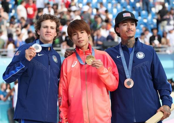 Japan s Yuto Horigome (C) and (L) Jagger Easton and (R) Nyjah Houston pose with their medals after the Men s Street Skateboard final at Place De La Concorde on the third day of the Paris Olympics on Monday, July 29, 2024. Japan s Horigome won the gold medal with USA s Eaton (L) and Huston (R)in silver and bronze medals  OLY20240729932 HUGOxPHILPOTT