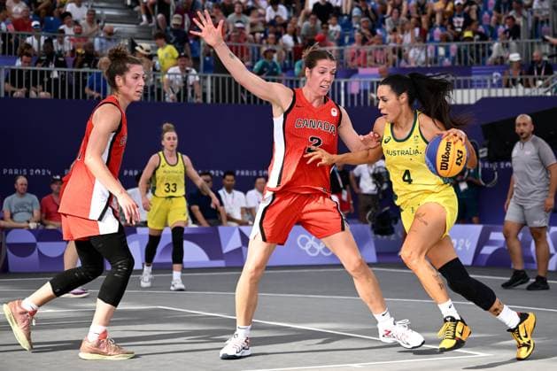 OLY24 3X3 BASKETBALL, Alex Wilson of Australia (right) goes past Katherine Plouffe of Canada during the Women?s 3x3 Basketball match between Australia and Canada at La Concorde Urban Park as part of the 2024 Paris Summer Olympic Games, Olympische Spiele, Olympia, OS in Paris, France, Tuesday, July 30, 2024. ( NO ARCHIVING, EDITORIAL USE ONLY, NO USE IN BOOKS WITHOUT CONSENT PARIS FRANCE Copyright: xJOELxCARRETTx 20240731130199557288