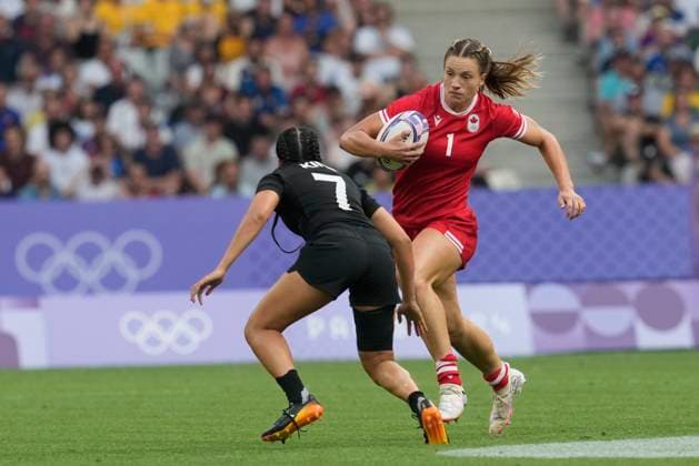 July 30, 2024, Paris, France: Canada forward Caroline Crossley (1) runs at New Zealand back Tyla King (7) during the women s rugby sevens gold medal match at the Summer Olympics in Paris on Tuesday, July 30, 2024. Canada News - July 30, 2024  - ZUMAc35_ 20240730_zaf_c35_056 Copyright: xAdrianxWyldx