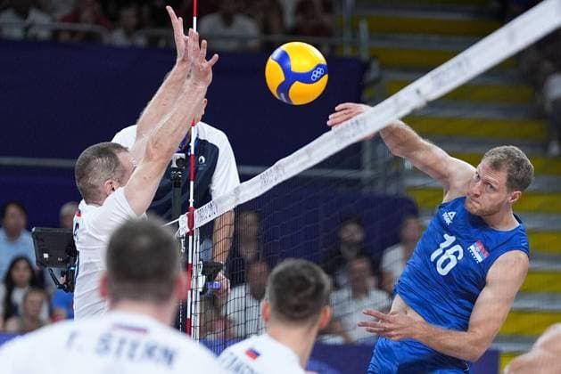 (240730) -- PARIS, July 30, 2024 -- Drazen Luburic (1st R) of Serbia spikes the ball during the men s preliminary round pool A match of volleyball between Slovenia and Serbia at the Paris 2024 Olympic Games, Olympische Spiele, Olympia, OS in Paris, France, July 30, 2024. ) (PARIS2024)FRANCE-PARIS-OLY-VOLLEYBALL JuxHuanzong 