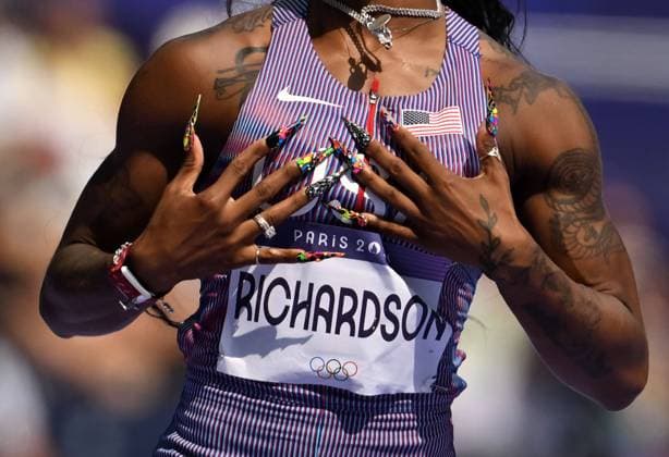 Highlight Bilder des Tages (240802) -- PARIS, Aug. 2, 2024 -- Sha Carri Richardson of the United States reacts after the women s 100m round 1 of Athletics at the Paris 2024 Olympic Games, Olympische Spiele, Olympia, OS in Paris, France, Aug. 2, 2024. ) (PARIS2024) FRANCE-PARIS-OLY-ATHLETICS-100M-WOMEN LuixSiuxWai 