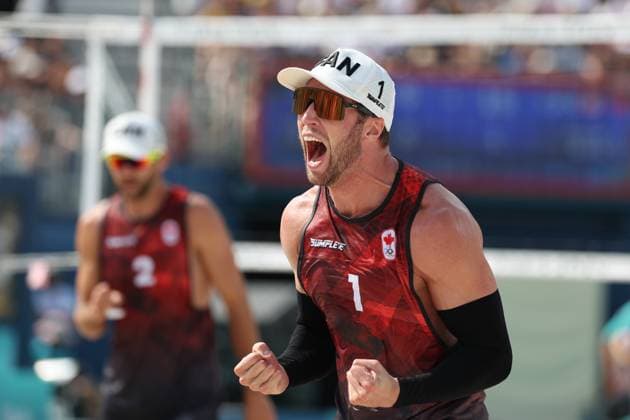 (240802) -- PARIS, Aug. 2, 2024 -- Samuel Schachter of Canada celebrates scoring during the men s preliminary phase pool E of Beach volleyball, Beachvolleyball between Julian Hoerl Alexander Horst of Austria and Samuel Schachter Daniel Dearing of Canada at the Paris 2024 Olympic Games, Olympische Spiele, Olympia, OS in Paris, France, Aug. 2, 2024. ) (PARIS2024) FRANCE-PARIS-OLY-BEACH VOLLEYBALL HuangxZongzhi 