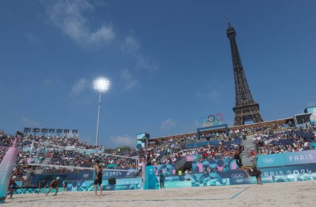 (240802) -- PARIS, Aug. 2, 2024 -- Alexander Horst of Austria (R, top) serves the ball during the men s preliminary phase pool E of Beach volleyball, Beachvolleyball between Julian Hoerl Alexander Horst of Austria and Samuel Schachter Daniel Dearing of Canada at the Paris 2024 Olympic Games, Olympische Spiele, Olympia, OS in Paris, France, Aug. 2, 2024. ) (PARIS2024) FRANCE-PARIS-OLY-BEACH VOLLEYBALL HuangxZongzhi