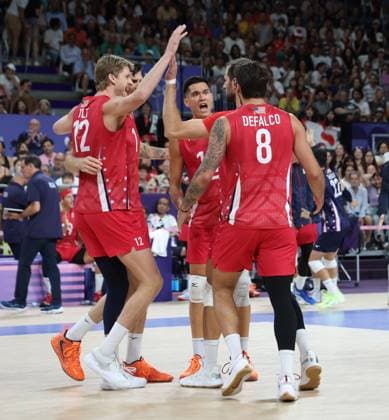 USA celebrate a point in their match against Japan in the Preliminary round of the Men s Volleyball at Porte De Versailles on the seventh day of the Paris Olympics on Friday, August 02, 2024.USA won the match 3 sets to one.  OLY202408021012 HUGOxPHILPOTT