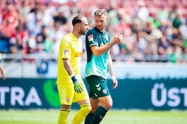 03.08.2024 - Fußball, 2024 2025, 2. Bundesliga, 1. Spieltag, Hannover 96 - SSV Jahn Regensburg: (L-R) Felix Gebhardt (Regensburg), Florian Ballas (Regensburg) DFL REGULATIONS PROHIBIT ANY USE OF PHOTOGRAPHS AS IMAGE SEQUENCES AND OR QUASI-VIDEO.