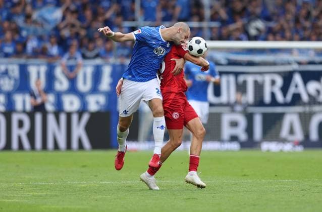 04.08.2024, xdcx, Fussball 2. Bundesliga, SV Darmstadt 98 - Fortuna Düsseldorf, emonline, emspor, despor, v.l., Aleksandar Vukotic (SV Darmstadt 98), Jona Niemiec (Fortuna Düsseldorf) DFL DFB REGULATIONS PROHIBIT ANY USE OF PHOTOGRAPHS AS IMAGE SEQUENCES AND OR QUASI-VIDEO.