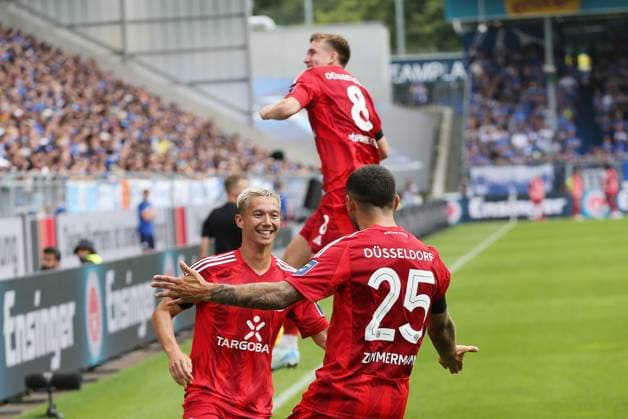 04.08.2024, xtvx, Fussball 2.Bundesliga, SV Darmstadt 98 - Fortuna Düsseldorf emspor, v.l. Zweikampf, Duell, duel, tackle, compete 0:1 Aleksandar Vukotic (SV Darmstadt 98) Eigentor Torjubel, Goal celebration, celebrate the goal, celebrates scoring Matthias Zimmermann (Fortuna Duesseldorf) (DFL DFB REGULATIONS PROHIBIT ANY USE OF PHOTOGRAPHS as IMAGE SEQUENCES and or QUASI-VIDEO) Darmstadt