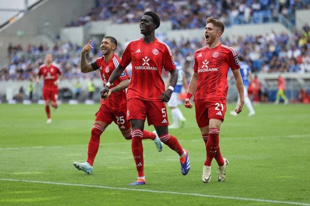 04.08.2024, xdcx, Fussball 2. Bundesliga, SV Darmstadt 98 - Fortuna Düsseldorf, emonline, emspor, despor, v.l., Torjubel zum 0:2 durch Tim Rossmann (Fortuna Düsseldorf), Joshua Quarshie (Fortuna Düsseldorf), Matthias Zimmermann (Fortuna Düsseldorf), Goal celebration, celebrate the goal DFL DFB REGULATIONS PROHIBIT ANY USE OF PHOTOGRAPHS AS IMAGE SEQUENCES AND OR QUASI-VIDEO.