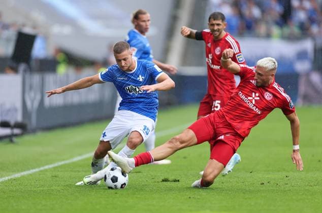 04.08.2024, xdcx, Fussball 2. Bundesliga, SV Darmstadt 98 - Fortuna Düsseldorf, emonline, emspor, despor, v.l., Fabian Nürnberger (SV Darmstadt 98), Jona Niemiec (Fortuna Düsseldorf) DFL DFB REGULATIONS PROHIBIT ANY USE OF PHOTOGRAPHS AS IMAGE SEQUENCES AND OR QUASI-VIDEO.