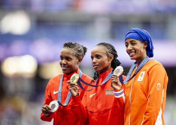 PARIS - Faith Kipyegon of Kenya, Beatrice Chebet of Kenya and the Dutch athlete Sifan Hassan during the ceremony the day after the 5000 meters during the Olympic Games, Olympische Spiele, Olympia, OS ANP ROBIN VAN LONKHUIJSEN xVIxANPxSportx xxANPxIVx 505319963 originalFilename: 505319963.jpg