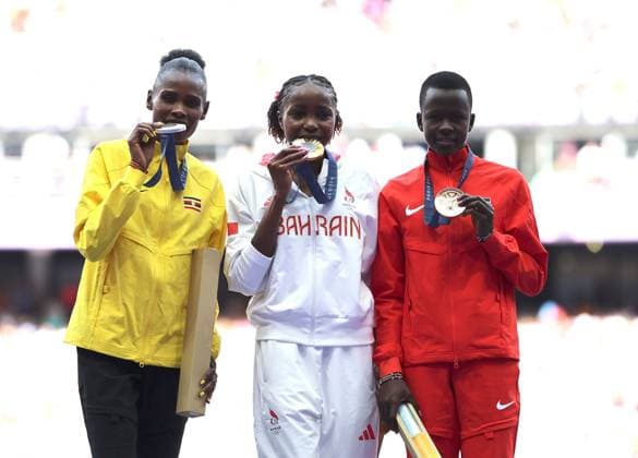 (240807) -- PARIS, Aug. 7, 2024 -- Gold medalist Winfred Yavi (C) of Bahrain, silver medalist Peruth Chemutai (L) of Uganda and bronze medalist Faith Cherotich of Kenya react during the victory ceremony of the women s 3000m steeplechase of Athletics at the Paris 2024 Olympic Games, Olympische Spiele, Olympia, OS in Paris, France, Aug. 7, 2024. ) (PARIS2024) FRANCE-PARIS-OLY-ATHLETICS-3000M STEEPLECHASE-WOMEN LixGang 