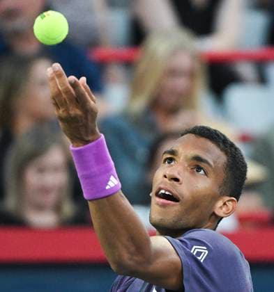 August 7, 2024, Montreal, Pq, Canada: Felix Auger-Aliassime of Canada tosses the ball as he serves to Flavio Cobolli of Italy during their first round match at the National Bank Open tennis tournament in Montreal, Wednesday, August 7, 2024. Flavio Cobolli, Félix Auger-Aliassime,  - ZUMAc35_ 20240807_zaf_c35_244 Copyright: xGrahamxHughesx
