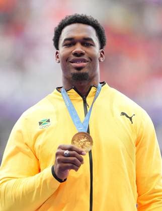 (240808) -- PARIS, Aug. 8, 2024 -- Gold medalist Roje Stona of Jamaica reacts during the victory ceremony of the men s discus throw of Athletics at the Paris 2024 Olympic Games, Olympische Spiele, Olympia, OS in Paris, France, Aug. 8, 2024. ) (PARIS2024) FRANCE-PARIS-OLY-ATHLETICS-DISCUS THROW-MEN XuxChang 