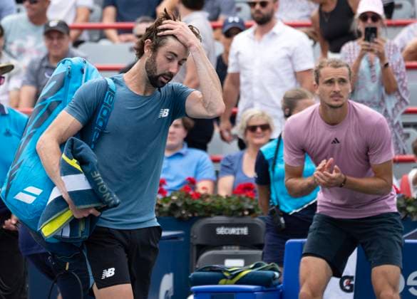 August 8, 2024, Montreal, Pq, Canada: Australia s Jordan Thompson, left, leaves the court as Germany s Alexander Zverev looks on after their second round match at the National Bank Open tennis Thursday, August 8, 2024 in Montreal. Zverev won the match in straight sets. Alexander Zverev, Jordan Thompson,  - ZUMAc35_ 20240808_zaf_c35_095 Copyright: xRyanxRemiorzx
