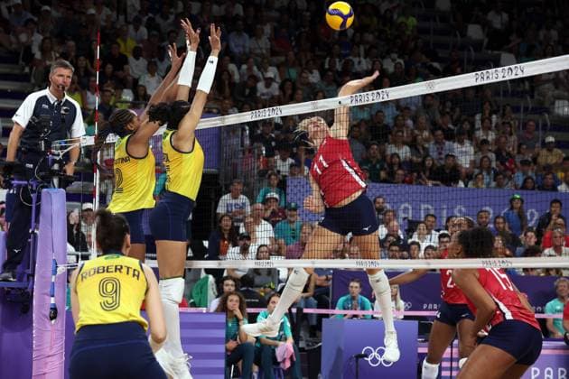 Team USA (red jersey) plays against Team Brazil (yellow jersey) during the Women s Volleyball semi-final of the 2024 Summer Olympics at the South Arena, in Paris, France, on Thursday, August 8, 2024. Team USA qualified for the final.  OLY202408062624 MAYAxVIDON-WHITE