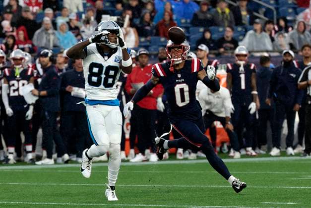 FOXBOROUGH, MA - AUGUST 08: New England Patriots cornerback Christian Gonzalez (0) looks for the pick off the handoff Carolina Panthers wide receiver Terrace Marshall Jr. (88) during a preseason game between the New England Patriots and the Carolina Panthers on August 8, 2024, at Gillette Stadium in Foxborough, Massachusetts. (Photo by Fred Kfoury III Icon Sportswire) NFL, American Football Herren, USA AUG 08 Preseason Panthers at Patriots EDITORIAL USE ONLY Icon482240808003