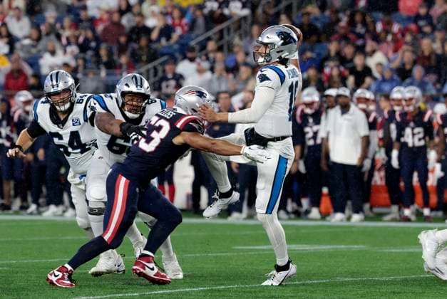 FOXBOROUGH, MA - AUGUST 08: Carolina Panthers quarterback Jack Plummer (16) throws pressured by New England Patriots linebacker Christian Elliss (53) during a preseason game between the New England Patriots and the Carolina Panthers on August 8, 2024, at Gillette Stadium in Foxborough, Massachusetts. (Photo by Fred Kfoury III Icon Sportswire) NFL, American Football Herren, USA AUG 08 Preseason Panthers at Patriots EDITORIAL USE ONLY Icon482240808026