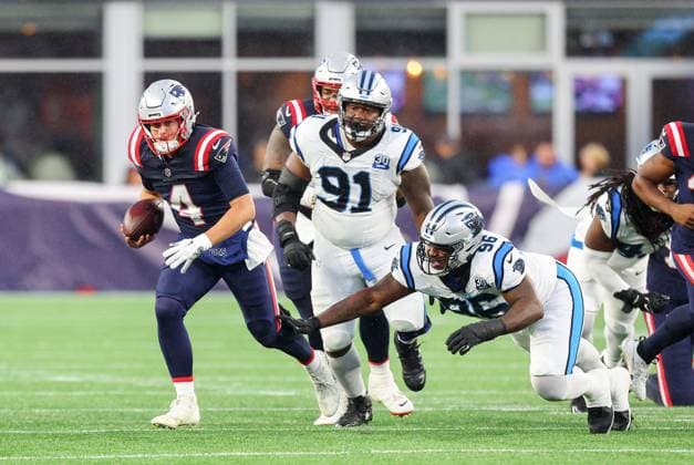 August 8, 2024; Foxborough, MA, USA; New England Patriots quarterback Bailey Zappe (4) scrambles with the ball during the NFL, American Football Herren, USA pre-season game between Carolina Panthers and New England Patriots in Foxborough, MA. CSM Foxborough United States - ZUMAc04_ 20240808_zma_c04_107 Copyright: xAnthonyxNesmithx