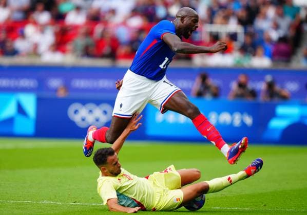 Eric Garcia of Spain challenges Jean Philippe Mateta of France during the Olympic Men s Football Final, France v Spain Paris 2024 Olympic Games, Olympische Spiele, Olympia, OS Day Fourteen, Paris, France - 09 Aug 2024 EDITORIAL USE ONLY No use with unauthorised audio, video, data, fixture lists (outside the EU), club league logos or live services. Online in-match use limited to 45 images (+15 in extra time). No use to emulate moving images. No use in betting, games or Copyright: xJavierxGarcia Shutterstockx 14622991bd