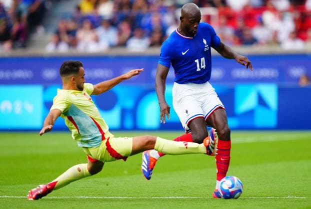 Eric Garcia of Spain challenges Jean Philippe Mateta of France during the Olympic Men s Football Final, France v Spain Paris 2024 Olympic Games, Olympische Spiele, Olympia, OS Day Fourteen, Paris, France - 09 Aug 2024 EDITORIAL USE ONLY No use with unauthorised audio, video, data, fixture lists (outside the EU), club league logos or live services. Online in-match use limited to 45 images (+15 in extra time). No use to emulate moving images. No use in betting, games or Copyright: xJavierxGarcia Shutterstockx 14622991bc