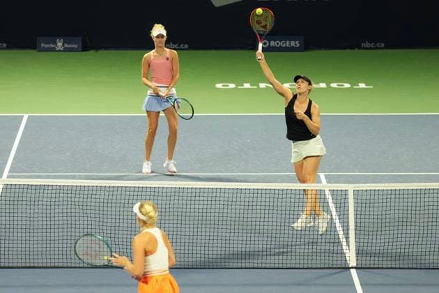 August 9, 2024, Toronto, On, CAN: Gabriela Dabrowski of Canada hits a return as she, and doubles partner Erin Routliffe from Australia play against Magda Linette of Poland and Peyton Stearns of the United States at the National Bank Open in Toronto on Friday, August 9, 2024. Gabriela Dabrowski; Erin Routliffe  - ZUMAc35_ 20240809_zaf_c35_200 Copyright: xChrisxYoungx