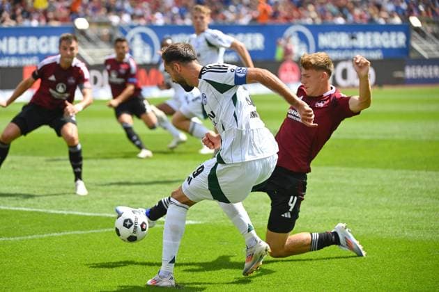 Kenan KARAMAN (FC Schalke 04), Aktion,Zweikampf gegen Finn JELTSCH (1.FC Nuernberg). Fussball 2.Bundesliga 1.FC Nuernberg - FC Schalke 04 2.Spieltag am 10.08.2023 Max Morlock Stadion Nuernberg, Saison 2024 25.