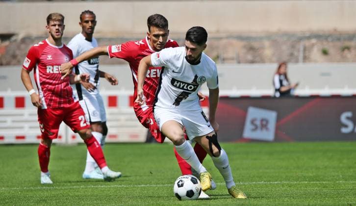 10.08.2024, xmohx, Fussball 2.Bundesliga, SV Elversberg - 1.FC Köln emspor, v.l. Dejan Ljubicio (Köln), Semih Sahin (Elversberg) (DFL DFB REGULATIONS PROHIBIT ANY USE OF PHOTOGRAPHS as IMAGE SEQUENCES and or QUASI-VIDEO) Elversberg