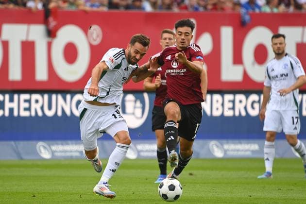 Kenan KARAMAN (FC Schalke 04), Aktion,Zweikampf gegen Jens CASTROP (1.FC Nuernberg). Fussball 2.Bundesliga 1.FC Nuernberg - FC Schalke 04 3-1 2.Spieltag am 10.08.2024 Max Morlock Stadion Nuernberg, Saison 2024 25.