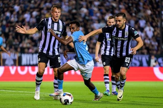 240813 Taha Ali of Malmö FF and Joan Sastre of PAOK during the UEFA Champions League football match between PAOK and Malmö FF on August 13, 2024 in Thessaloniki. Photo: Mathilda Ahlberg BILDBYRAN kod MA MA0703 fotboll football soccer fotball champions league paok malmö ff bbeng Copyright: MATHILDAxAHLBERG BB240813MA093