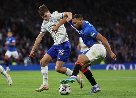 Football - 2024 2025 UEFA Champions League - Third Qualifying Round - Second Leg - Glasgow Rangers vs Dynamo Kyiv - Hampden Park - Tuesday 13th August 2024 Cyriel Dessers of Rangers vies with Vladislav Kabayev of Dynamo Kyiv 
