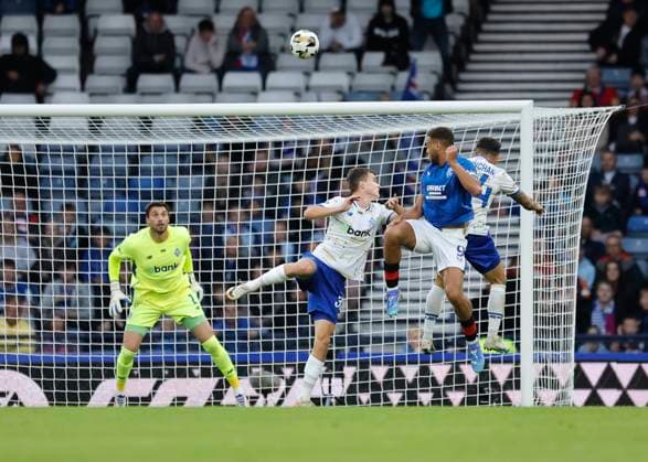 Rangers v FC Dynamo Kyiv UEFA Champions League Cyriel Dessers of Rangers (middle) wins a header during the UEFA Champions League Third Qualifying Round Second Leg match at Hampden Park, Glasgow UK Newspapers OUT Copyright: xFredxPalmerx FIL-20489-0149