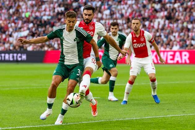AMSTERDAM, 15-08-2024 , JohanCruyffStadium Football UEFA Europa League qualifier season 2024 2025. Ajax player Josip Sutalo vs Panathinaicos player Filip Duricic during the match Ajax - Panathinaikos. Ajax - Panathinaikos  x26037474x Copyright: