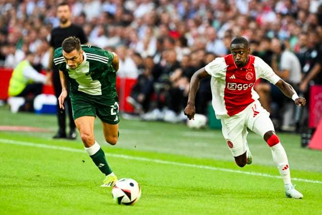 AMSTERDAM - Giannis Kotsiras of Panathinaikos, Carlos Forbs of Ajax (l-r) during the 3rd qualifying round UEFA Europa League match between Ajax and Panathinaikos at the Johan Cruijff ArenA on August 15, 2024 in Amsterdam. ANP OLAF KRAAK Ajax Amsterdam v Panathinaikos 2024 35 xVIxANPxSportx xxANPxIVx 506070481 originalFilename: 506070481.jpg
