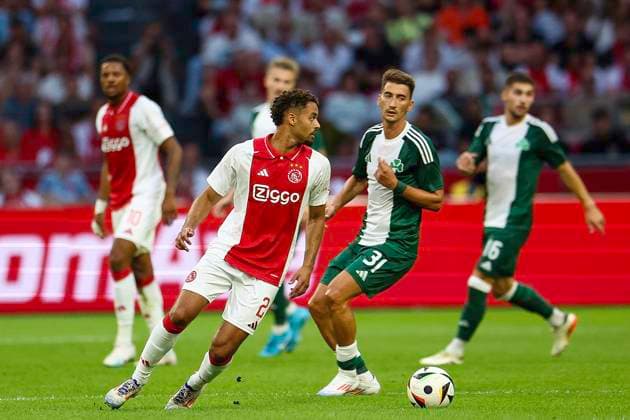 AMSTERDAM, 15-08-2024 , JohanCruyffStadium Football UEFA Europa League qualifier season 2024 2025. Ajax player Devyne Rensch vs Panathinaicos player Filip Duricic during the match Ajax - Panathinaikos. Ajax - Panathinaikos  x26037492x Copyright:
