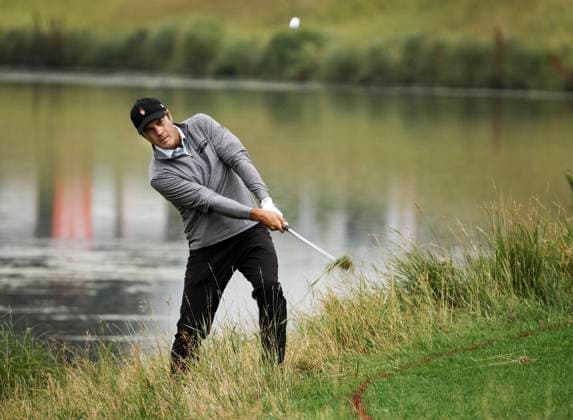 August 16, 2024, Calgary, Ab, CANADA: Mario Tiziani, of the United States, hits from the rough near the water on the 18th hole during the PGA, Golf Herren Tour Champions golf event in Calgary, Alta., Friday, Aug. 16, 2024. Mario Tiziani, - ZUMAc35_ 20240816_zaf_c35_091 Copyright: xJeffxMcintoshx