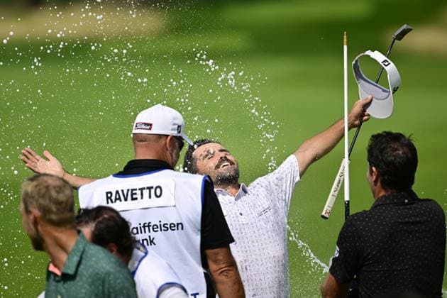 David Ravetto of France, center, celebrates after winning the Czech Masters golf tournament of DP World Tour European series in Nebrenice, Czech Republic, August 18, 2024. (CTKxPhoto RomanxVondrous) CTKPhotoP2024081802771  CTKPhotoP2024081802771
