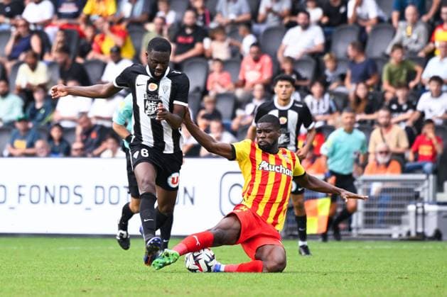 Jean Eudes Aholou ( 6 - Angers ) and Kevin Danso ( 4 - Lens ) during the Ligue 1 match between Angers SCO and RC Lens at Stade Raymond Kopa on August 18, 2024 in Angers, France. ( Photo by federico pestellini panoramic ) - FOOTBALL : Angers vs Lens - Ligue 1 - 18 08 2024 FedericoPestellini Panoramic 