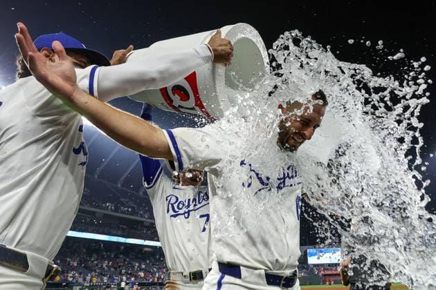 August 19, 2024: Kansas City Royals third baseman Paul DeJong (15) is doused by Kansas City Royals left fielder MJ Melendez (1), left, and Kansas City Royals shortstop Bobby Witt Jr. (7), after their 5-3 win over the Los Angeles Angels in a baseball game at Kauffman Stadium in Kansas City, MO. CSM Kansas City United States of America - ZUMAc04_ 20240819_zma_c04_026 Copyright: xDavidxSmithx