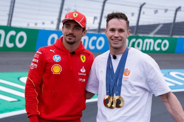 Harry Lavreysen dutch olympic champion track cyclist on his golden bike shows his three golden medals and Charles Leclerc of Monaco and Scuderia Ferrari during previews ahead of the F1 Grand Prix of Netherlands at Circuit Park Zandvoort on August 22, 2024 in Zandvoort, Netherlands. Defodi-704_MTB20240822F1ZandvoortDag1352580
