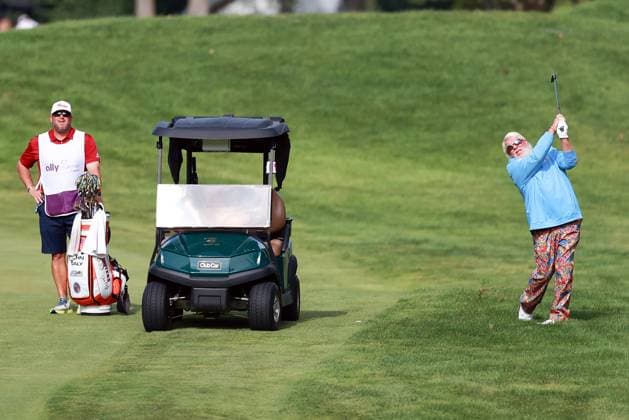 The Ally Challenge GRAND BLANC,MICHIGAN-AUGUST 23: John Daly of the United States hits from the 10th fairway as his caddie looks on during the first round of The Ally Challenge presented by McLaren at Warwick Hills Golf & Country Club, Grand Blanc, MI, USA Friday, August 23, 2024. Grand Blanc Michigan United States  Copyright: xAmyxLemusx originalFilename:lemus-theallyc240823_npjPL.jpg