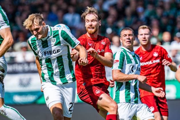 24.08.2024, SC Preußen Münster vs. 1. FC Kaiserslautern, 2. Bundesliga, 3. Spieltag Jannis Heuer (1. FC Kaiserslautern, 24) Mikkel Kirkeskov (Preussen Muenster, 2) Wichtiger Hinweis: Gemaess den Vorgaben der DFL Deutsche Fussball Liga bzw. des DFB Deutscher Fussball-Bund ist es untersagt, in dem Stadion und oder vom Spiel angefertigte Fotoaufnahmen in Form von Sequenzbildern und oder videoaehnlichen Fotostrecken zu verwerten Foto: Bahho Kara Kirchner-Media