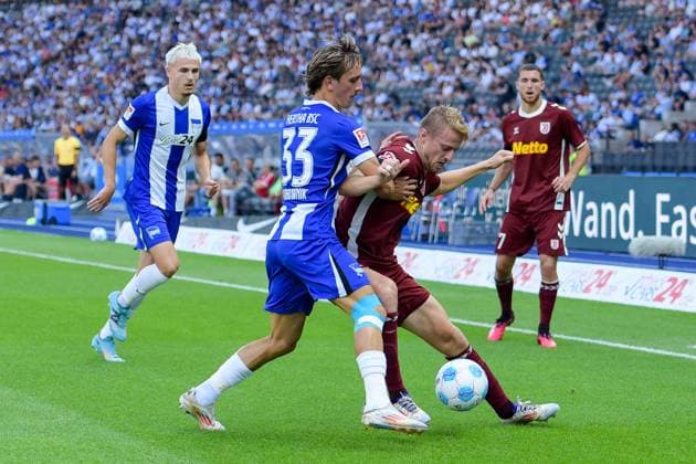 24.08.2024, xlakx, Fussball 2.Bundesliga, Hertha BSC Berlin - Jahn Regensburg emspor, v.l. Marten Winkler (Hertha BSC 22),Michal Karbownik (Hertha BSC 33),Sebastian Ernst (SSV Jahn Regensburg 15),Zweikampf, Duell, Kampf, tackle (DFL DFB REGULATIONS PROHIBIT ANY USE OF PHOTOGRAPHS as IMAGE SEQUENCES and or QUASI-VIDEO) Daniel Lakomski Jan Huebner Berlin