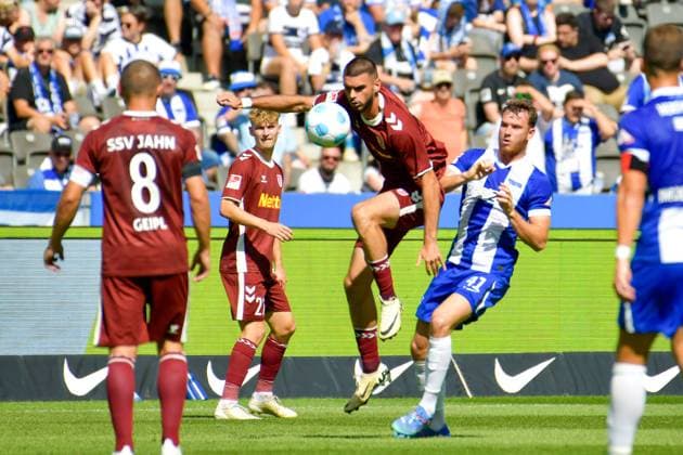 24.08.2024, xlakx, Fussball 2.Bundesliga, Hertha BSC Berlin - Jahn Regensburg emspor, v.l. Rasim Bulic (SSV Jahn Regensburg 5),Pascal Klemens (Hertha BSC 41),Zweikampf, Duell, Kampf, tackle (DFL DFB REGULATIONS PROHIBIT ANY USE OF PHOTOGRAPHS as IMAGE SEQUENCES and or QUASI-VIDEO) Daniel Lakomski Jan Huebner Berlin