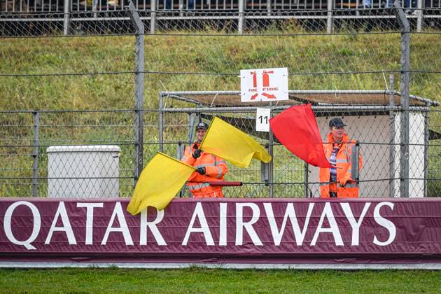 24th August 2024; Circuit Zandvoort, Zandvoort, North Holland, Netherlands; Formula 1 Heineken Dutch Grand Prix 2024; Qualifying Day; Marshalls wave red and yellow flags to signal the session is stopped due to a crash by Logan Sargeant (USA) in the FW45 of Williams Racing  ActionPlus12684932 GodfreyxPitt