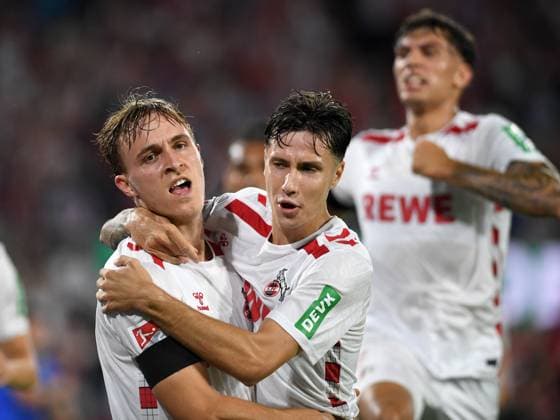 Koeln, Deutschland, 24.08.24: Timo Huebers (1. FC Koeln) und Denis Huseinbasic (1. FC Koeln) Torjubel, jubelt mit seiner Mannschaft nach dem Treffer zum 1:0 waehrend des Spiels der 2. Bundesliga zwischen 1. FC Koeln vs Eintracht Braunschweig im Rhein-Energie-Stadion am 24. August 2024 in Koeln, Deutschland. (Foto von Ralf Treese DeFodi Images) Cologne, Germany, 24.08.24: Timo Huebers (1. FC Koeln) und Denis Huseinbasic (1. FC Koeln) celebrates after scoring his team™s first goal with teammates during the 2. Bundesliga match between 1. FC Koeln vs Eintracht Braunschweig at Rhein-Energie-Stadium on August 24, 2024 in Cologne, Germany. (Photo by Ralf Treese DeFodi Images) DFB DFL REGULATIONS PROHIBIT ANY USE OF PHOTOGRAPHS AS IMAGE SEQUENCES AND OR QUASI-VIDEO. Defodi-521_KOEBRA20240824_037